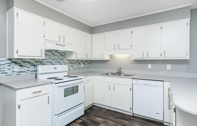 a stove top oven sitting inside of a kitchen