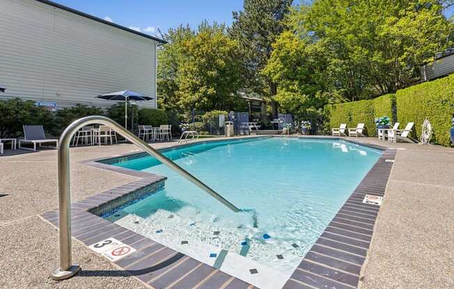 A pool with a slide and no swimming allowed sign.