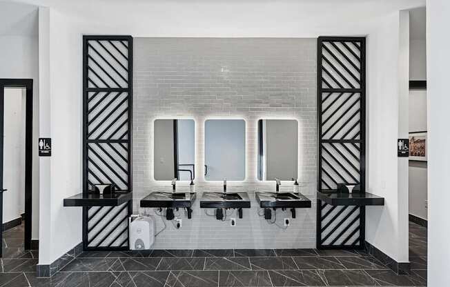 A bathroom with a white and black color scheme.