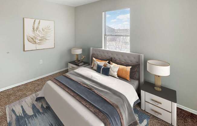 A bedroom with a large bed, a nightstand with a lamp, and a framed picture on the wall.