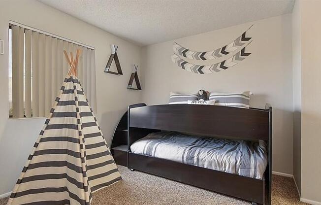 One Bedroom Apartments in Mesa AZ - Mesa Station - Bedroom with Carpet Flooring and a Large Window