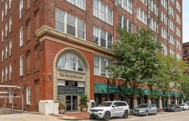 A street view of a building with the sign "The Power Building 224".