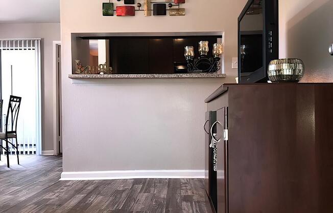 a modern kitchen with stainless steel appliances and wooden cabinets