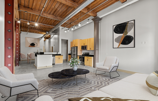Modern loft apartment featuring exposed wooden beams