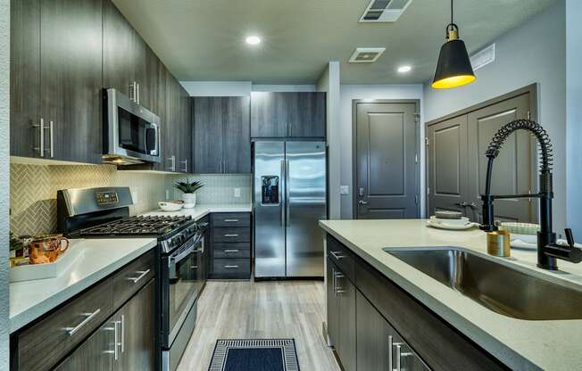 Gourmet kitchen with stainless steel appliances at The Rey Downtown, Phoenix