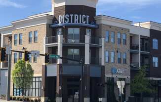 a building with a sign on top of it on a city street