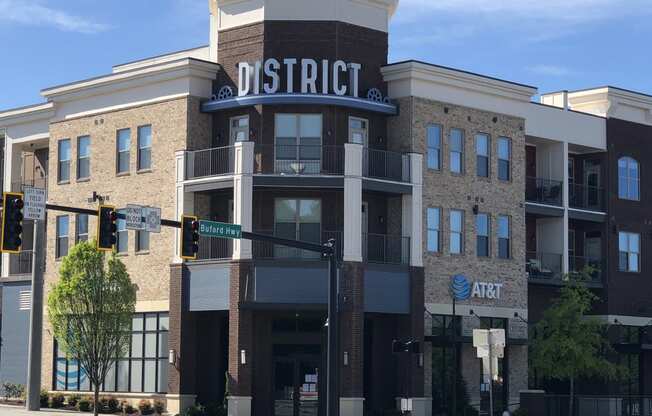 a building with a sign on top of it on a city street