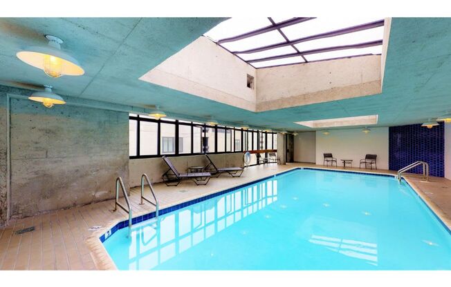 a swimming pool with a skylight above it