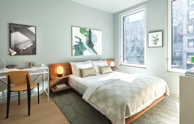 Step into the elegance of Mabel, where modern design meets comfort. This bright bedroom, featuring large windows and stylish decor, invites relaxation. Explore our unique amenities and schedule your tour today to see your future home!