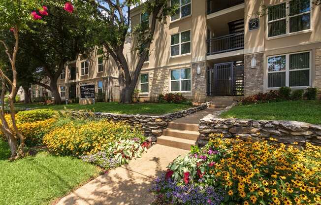 This is a photo of building exteriors and the grounds at The Summit at Midtown Apartments in Dallas, TX.