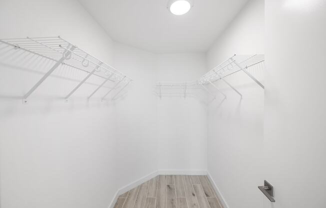 a room with white walls and a wooden floor