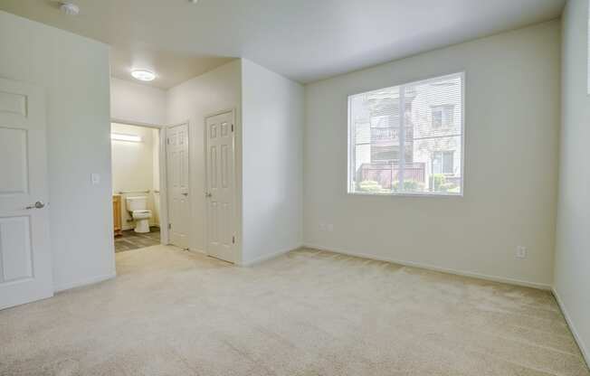 a bedroom with a large window and carpeting  at Seville at Gale Ranch, California, 94582