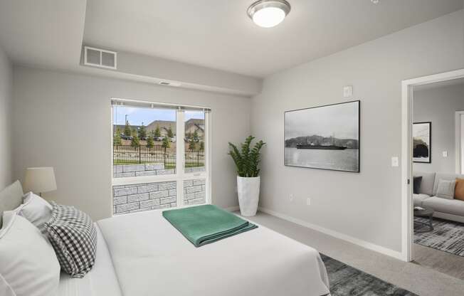 Two BR Apartments in Lakeville MN - Lakeside Flats - Carpetted Bedroom, Unfurnished, with Light Grey Walls, Large Windows, and Overhead Lighting