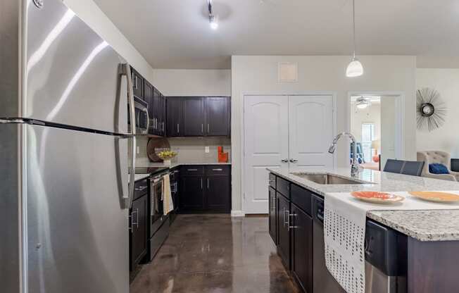 Kitchen Island with Stainless Steel Appliances and Cabinetry