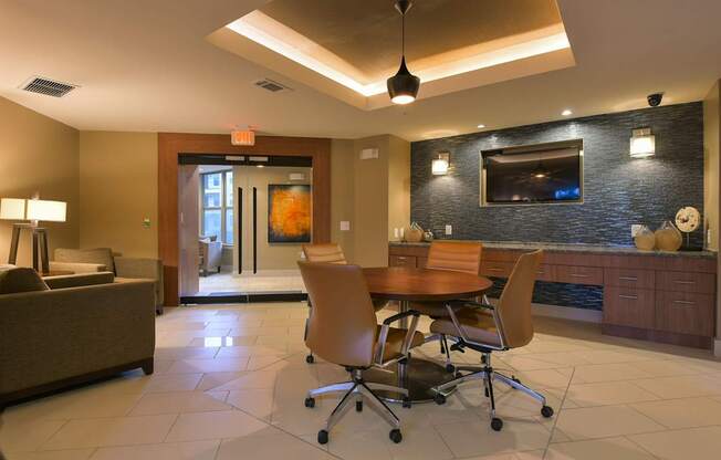 A modern living room with a brown couch, a wooden table, and a television.