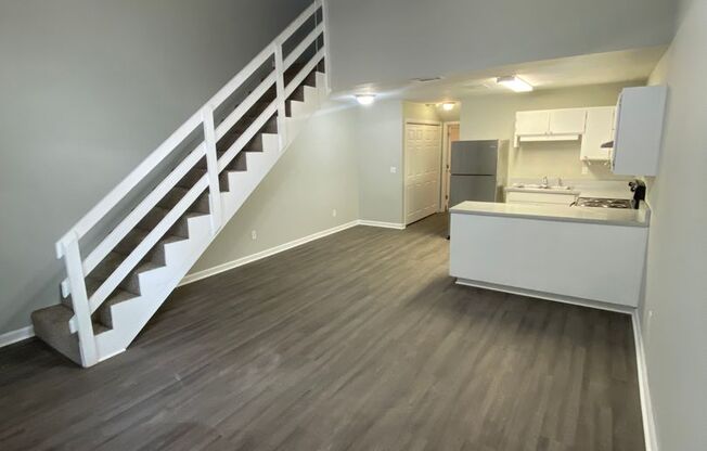 Freshly Remodeled 2 BR 2 BA Townhome Available Now! Beautiful New Flooring, Paint, And More!