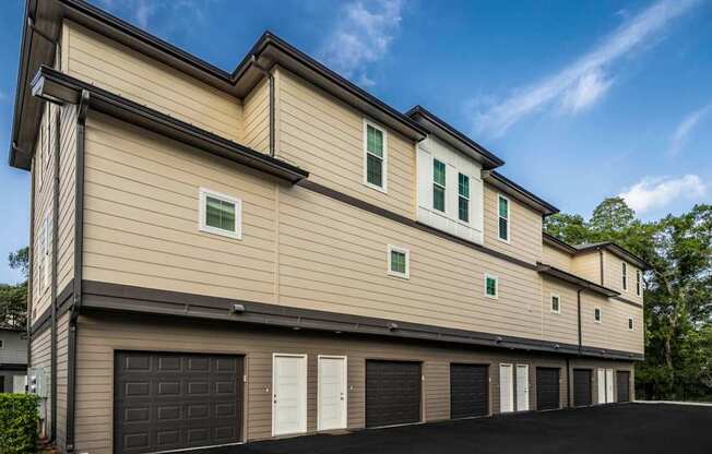 A modern two-story house with a garage on the ground floor.