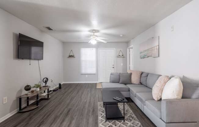 a living room with a couch and a tv