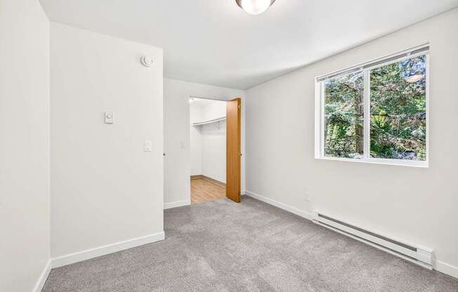 A room with a window and a door.