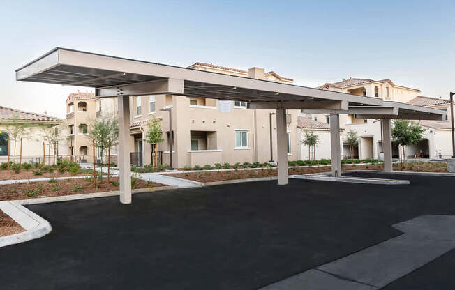 A modern building with a large covered walkway in front.