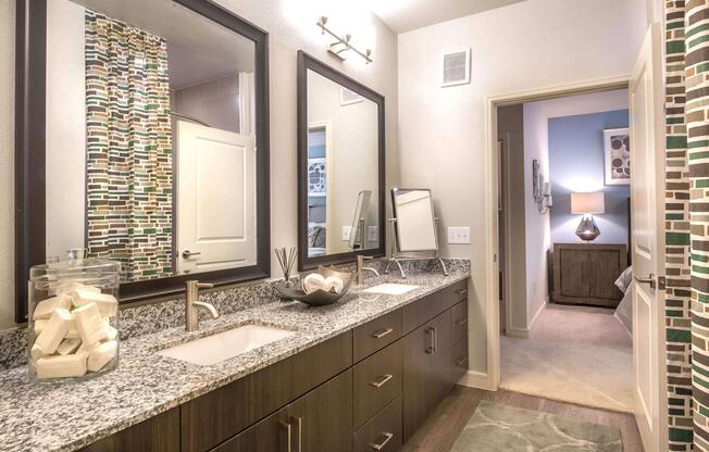 a kitchen with a sink and a mirror