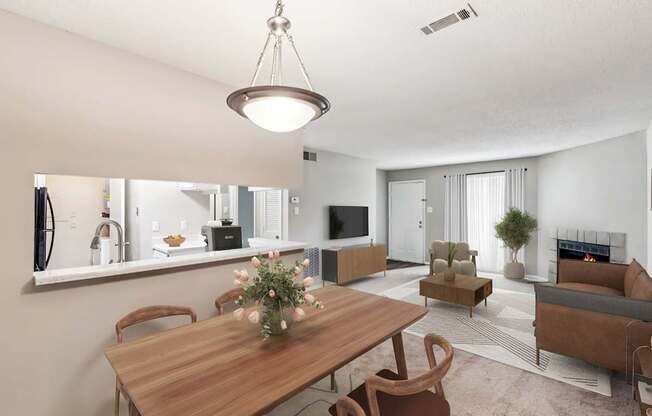 A modern living room with a wooden dining table and chairs.