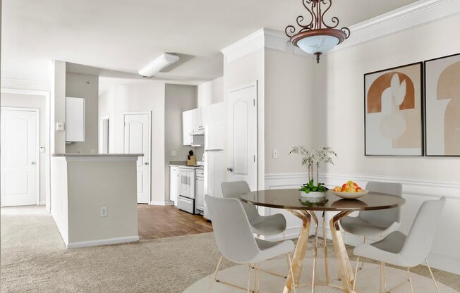 an open kitchen and dining room with a table and chairs