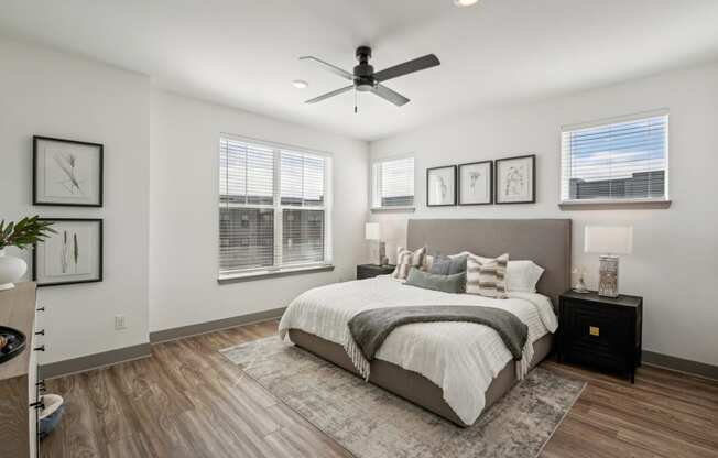 a bedroom with a bed and a ceiling fan at Meridian at CityPlace, Woodbury, Minnesota