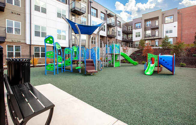 A playground with a slide, swings, and a climbing frame.