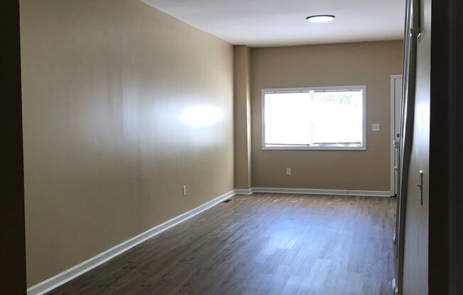 Great Home! 4 Bedrooms! Lots of Living Space! Updated Kitchen with Granite Counters! New Wood Flooring!