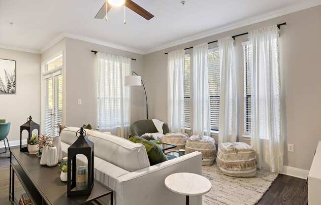 a living room with white curtains and a white couch at The Verandah, Texas, 78726