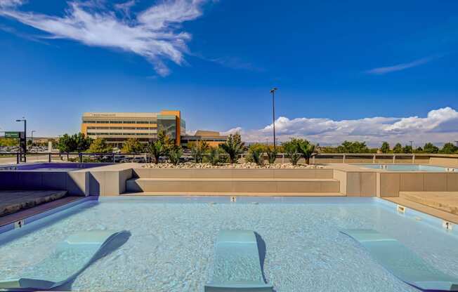 a pool with a building in the background