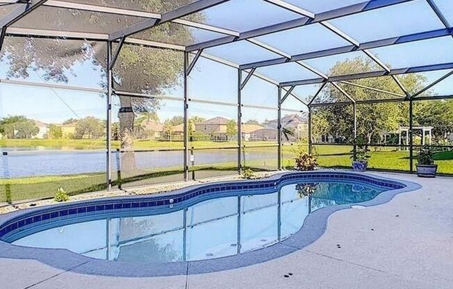 Gorgeous waterfront 4 beds 2 and half baths  home in highly desirable Eagle Creek Community in the heart of Lake Nona.