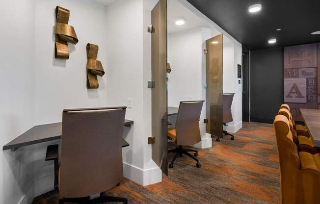 A conference room with a long table and chairs.
