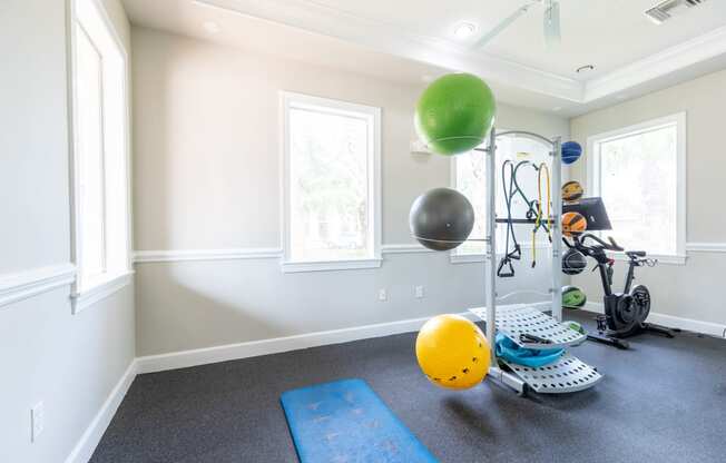 a home gym with a treadmill and exercise balls at Heritage Bay, Jensen Beach, 34957