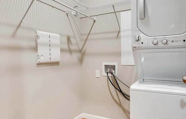 the laundry room has a washer and dryer and a dryer in it. Circle Pines, MN Lexington Lofts