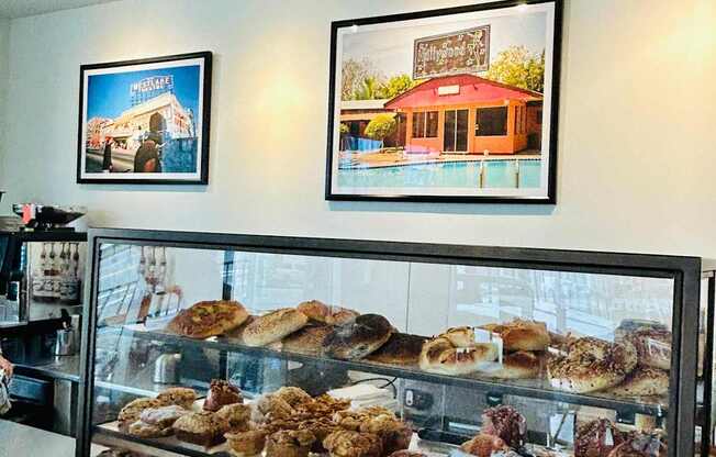 A bakery display case filled with various baked goods.