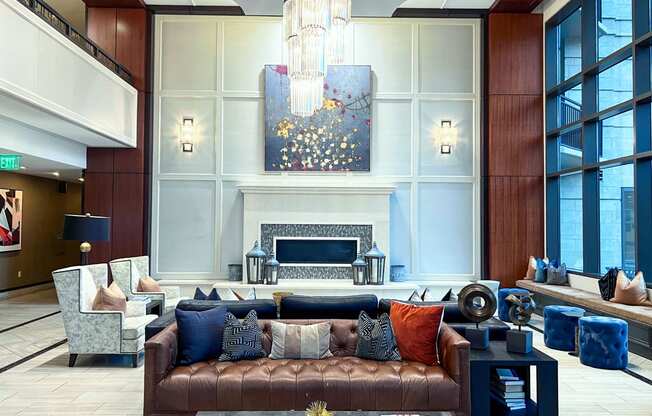 a large living room with a couch and a fireplace