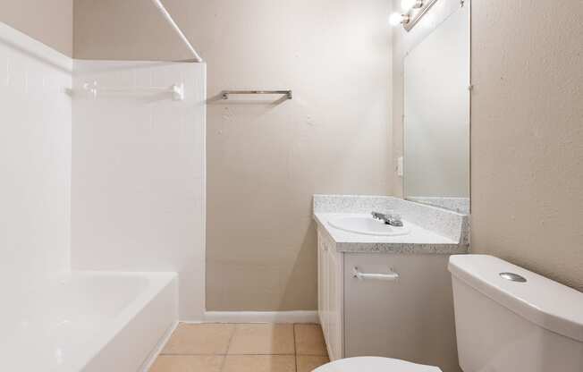 a bathroom with a sink toilet and bathtub at Del Rio Apartment