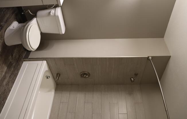 an overhead view of a bathroom with a toilet and a sink