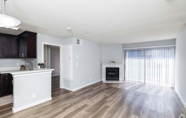 A modern kitchen with dark wood cabinets and a white island.