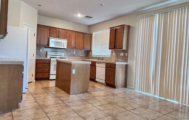 Welcome to this beautifully maintained two-story home offering 4 spacious bedrooms and 3 full bathrooms, including a convenient downstairs bedroom with its own shower—ideal for guests or multi-generational living.