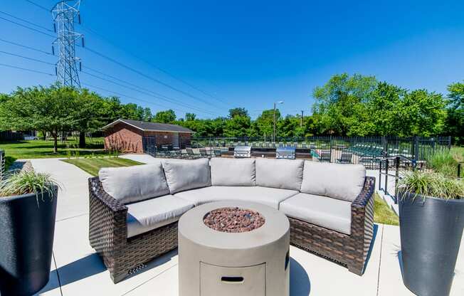 Ashton Brook Apartments offers an outdoor social space with a fire pit and barbecue grills