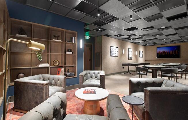 a room with couches chairs and tables