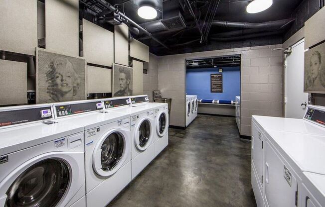 a laundromat with white washers and dryers