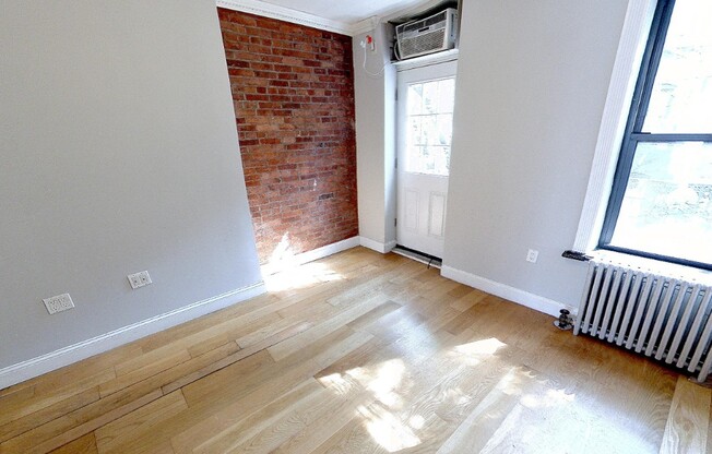 102 E 7TH ST
