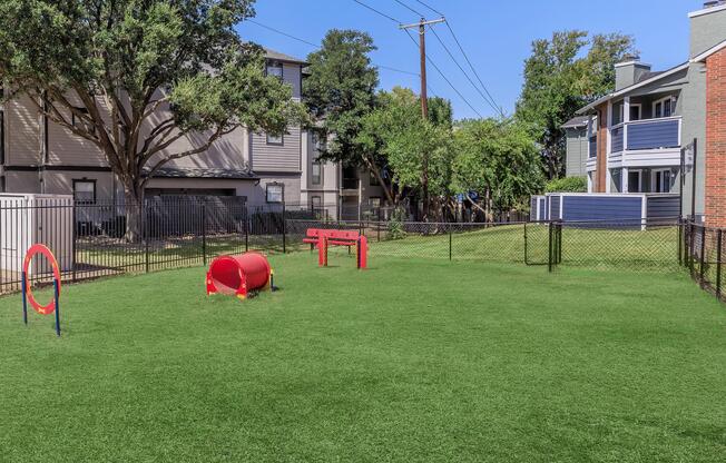 a yard with grass and a building