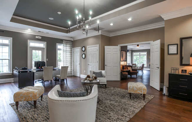 A living room with a white sofa and a rug.