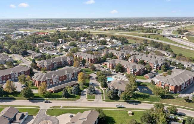 A view of a residential area with houses and a road.