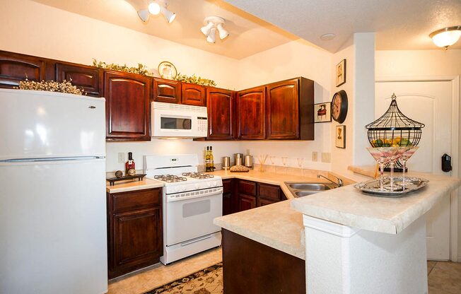 State of the art kitchen complete with white appliances and island